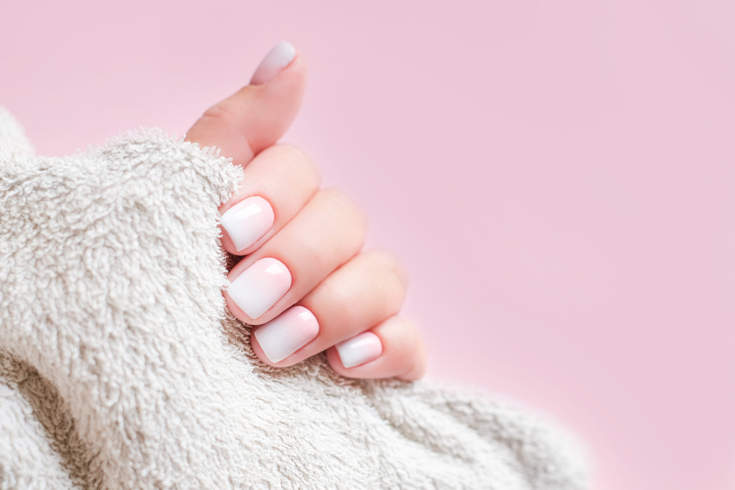 gradient-manicure-hands-spa-beautiful-woman-hand-closeup-manicured-nails-soft-hands-skin-beautiful-womans-nails-with-beautiful-baby-boomer-manicure-pink-background-copy-space